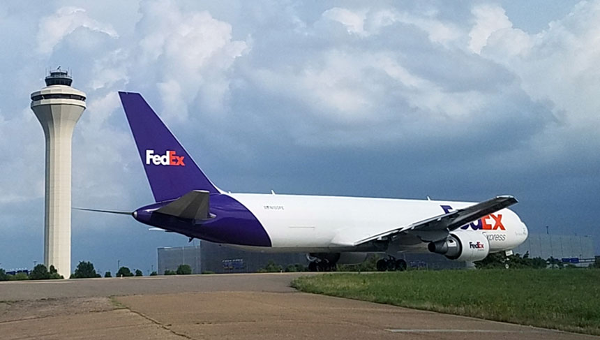 Afternoon FedEx flight on TWY N heading to RWY 18R for departure